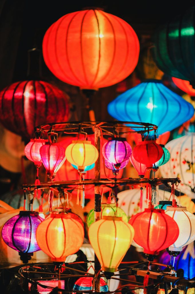 Vibrant traditional lanterns create a festive atmosphere with brilliant colors and dynamic lighting.