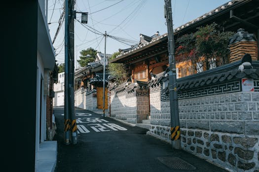 Explore a peaceful traditional street in Seoul with charming architecture and urban scenery.